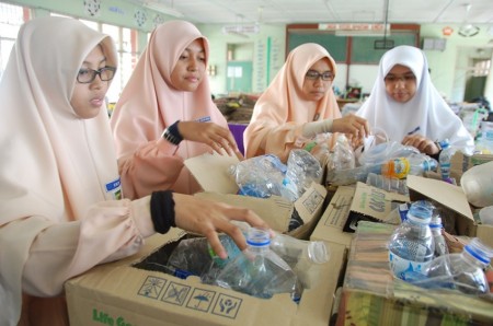 Members of the Science & Environment Club sorting out used plastic bottles