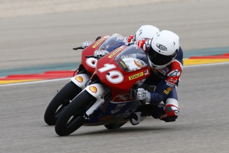 Malaysian rider leading a Japanese rider into a corner